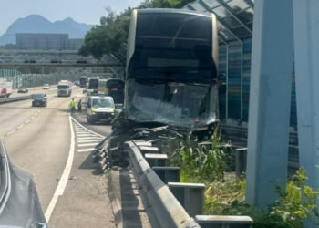 At least 10 injured after bus hits pavement