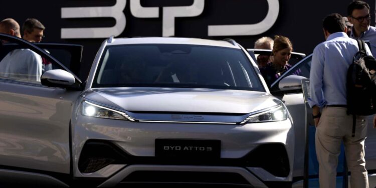 BYD posts record annual revenue, beats Tesla