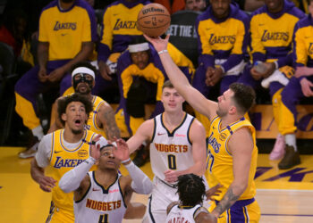 Doncic in solid-gold show for win over Nuggets