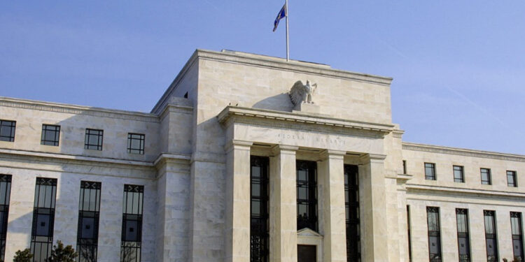 US Fed pauses rate cuts again, flags higher inflation
