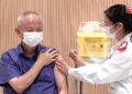 Jabs urged as doctors fear flu season overlap