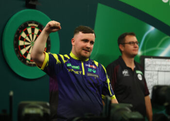 Darts champ hits all marks for third consecutive final