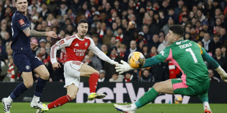 Quadruple chasing Arsenal rout Wigan in FA Cup