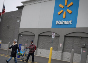 Weakness in Walmart and Apple drag Wall Street down