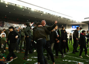 Fans in pitch battle after Celtic beat Rangers in Cup