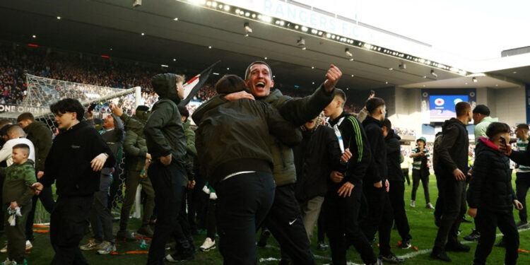 Fans in pitch battle after Celtic beat Rangers in Cup